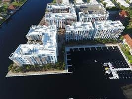 A bird’s-eye-view shows the Modera Port Royale apartments and adjacent marina