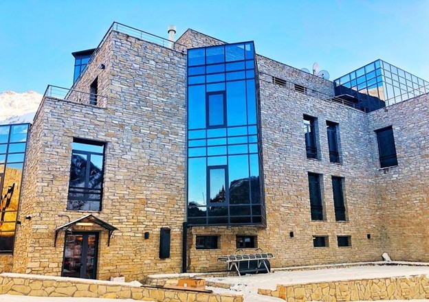 The elegant, natural stone 33-room Porta Caucasia boutique hotel in Kazbegi, Georgia, sits on a durable PENETRON-treated concrete foundation.