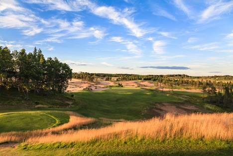 A view of the Sand Valley Golf Resort in Wisconsin shows the sand dunes and low-lying scrub vegetation that reflect the topography of great English courses.
