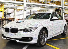 Autographed BMW rolls of the line of new plant.