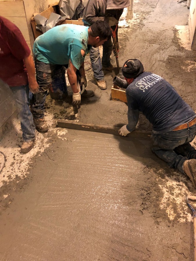 LEVELINE 15, a self-leveling underlayment from PSP, was applied to the concrete basement slab to ensure a perfectly level surface for the final layer of ceramic tiles