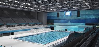 A completed Dagály Aquatic Center shows how massive the project was: a 19,000 m2 (204,500 square feet) footprint with two spectator areas each adding 2,000 m2 (21,500 square feet).