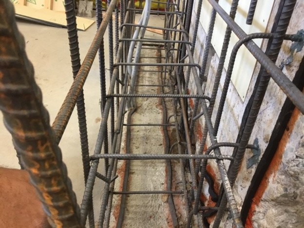 This close-up of the side wall area of the San Diego MTS wheel truing pit shows where the PENEBAR SW waterstop will seal the resulting construction joints in the new concrete.