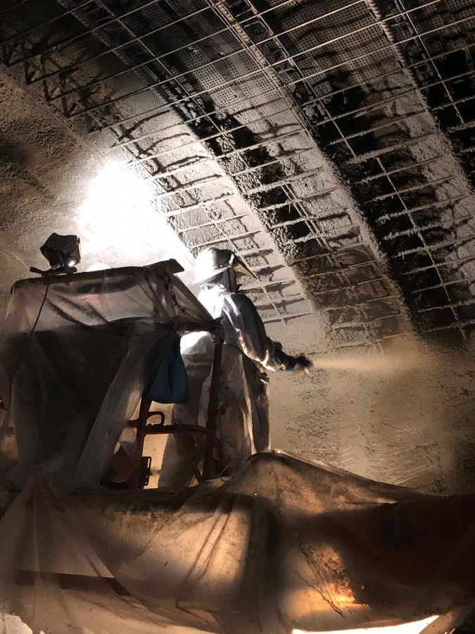 Shotcrete is shot through a hose at high pressure onto the surface. The force of the application compacts the applied shotcrete, creating a solid concrete structure