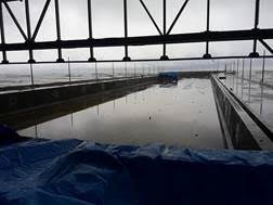 A wet winter day shows the view across the PENETRON-treated concrete pool structures out to the Black Sea